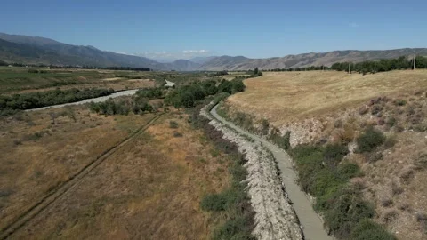 Drone flying over the Chong-Kemin River valley in Kyrgyzstan Stock Footage 345219539
