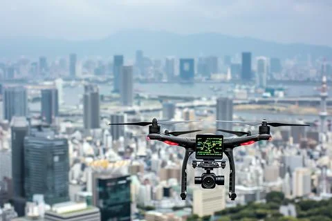 A drone flying over a cityscape, capturing digital footage and data, with a c Foto stock