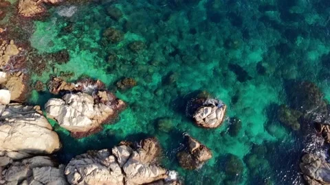 Drone Flying Over Clear Turquoise Sea with Downward View Stock Footage 306015189