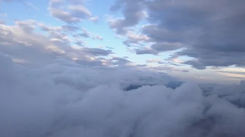 Drone flying over the clouds in mountains during the sunset Stock Footage 93034987