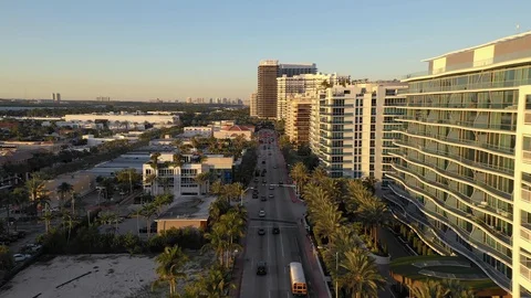 Drone Flying Over Collins Ave at Sunset Stock Footage 100571201