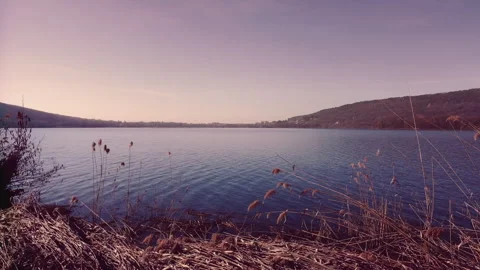 Drone Flying Over Comabbio Lake During Purple Sunrise in Lombardy Italy Видео 316443497