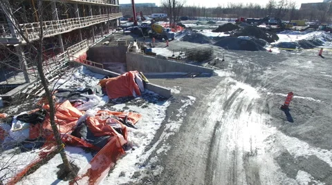 Drone flying over construction site in the winter Stock Footage 64123289