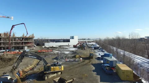 Drone flying over construction site in the winter Stock Footage 64123803