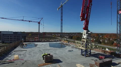 Drone flying over construction site next to a red crane Video stock 64145270