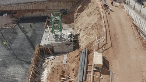 Drone flying over construction site with people working 스톡 동영상 140755663