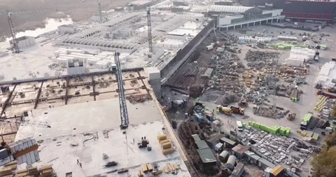 Drone flying over the construction site of a shopping center with construction Stock Footage 143652768