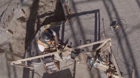 Drone flying over construction worker Stock Footage 63882666