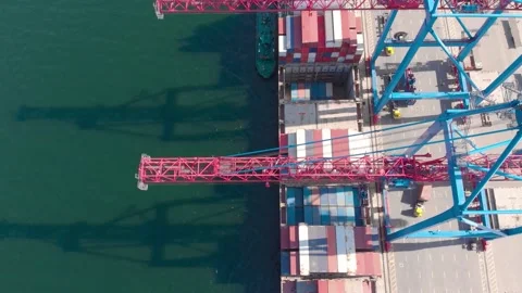 Drone flying over a container ship during cargo operations over the customs area 動画素材 137220445