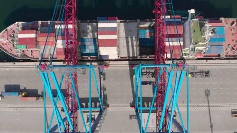 Drone flying over a container ship during cargo operations over the customs area Stock Footage 137220678