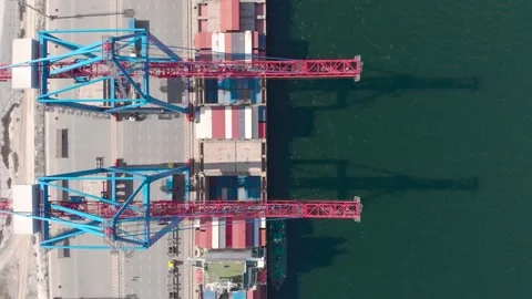 Drone flying over a container ship during cargo operations over the customs area Stock Footage 137220720