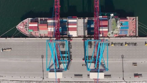 Drone flying over a container ship during cargo operations over the customs area Stock Footage 137220782