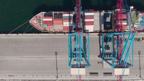 Drone flying over a container ship during cargo operations over the customs area Stock Footage 137220845