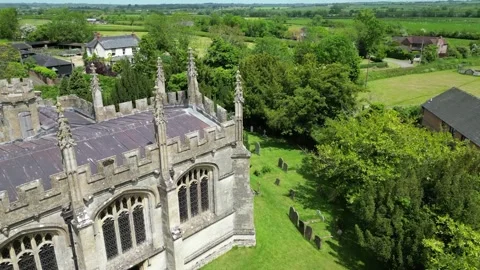 Drone flying over corner of St Mary's Church North Marston Stock Footage 242600331