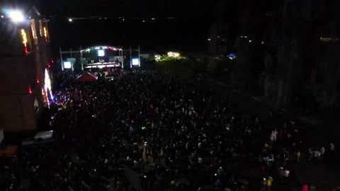 Drone flying over crowd assisting of show with laser lights and music. Stock Footage 231124783