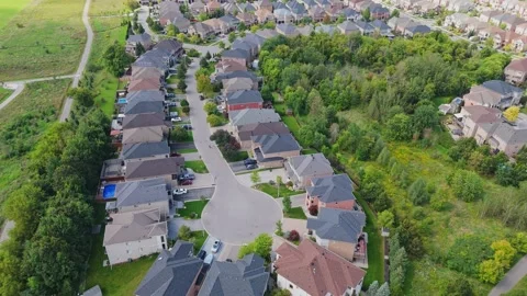 Drone flying over cul-de-sac into larger neighborhood Stock Footage 250422439