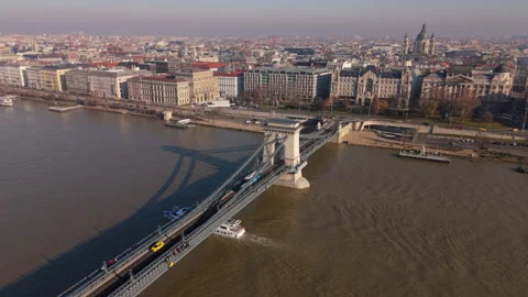 Drone flying over the Danube river with bridge connecting two banks, Budapest Stock Footage 265209483