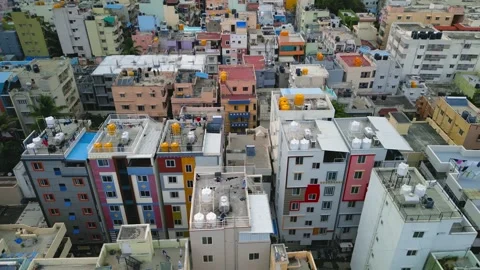 Drone flying over a dense urban indian neighborhood in Bengaluru, India. 動画素材 339127661
