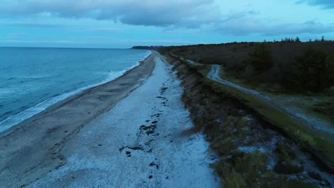 Drone flying over desolate beach on a winter morning Stock Footage 287915462