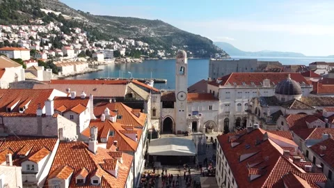 Drone Flying Over Dubrovnik Old Town with Red Roofs and Views of the Sea Stock Footage 283374438