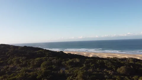 Drone flying over dunes onto Wild Coast beach - Eastern Cape, South Africa Stock Footage 217470706