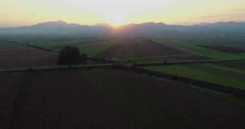 Drone flying over farming fields at sunset in Slovenia Video stock 147487729