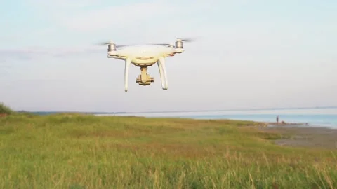 Drone flying over field at sunset Video HD Stock Footage 169906310