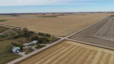 Drone Flying Over Fields Of Rolled Hay Bales And Four Way Intersection Stock Footage 229187189