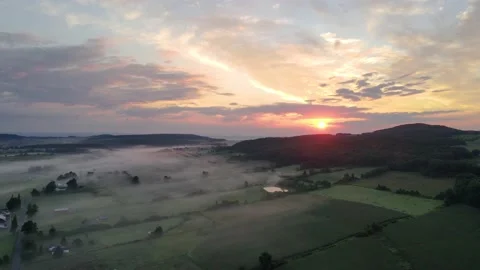 Drone flying over fields in Upstate New York, USA, watching the sunrise Video stock 145855257