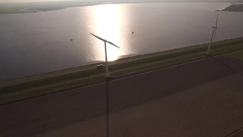 Drone flying over fields, windmill and dike in The Netherlands Stock Footage 75351294