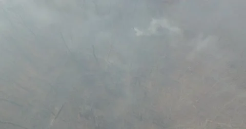 Drone flying over a fire in the woods Stock Footage 67643543
