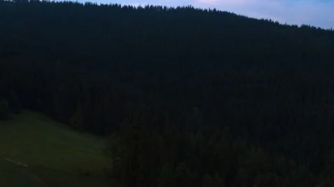 Drone flying over the forest and glade in the mountains 4k HDR H264 Stock Footage 88323946