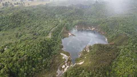 Drone Flying Over Frying Pan Lake and Lush New Zealand Bush Stock Footage 317469690