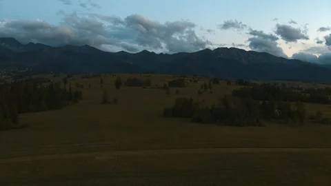 Drone flying over a glade in the mountains 4k HDR H264 Stock Footage 88321759
