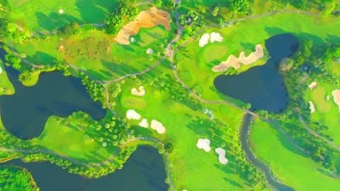 Drone flying over golf course in the morning with sunshine Stock Footage 225414988