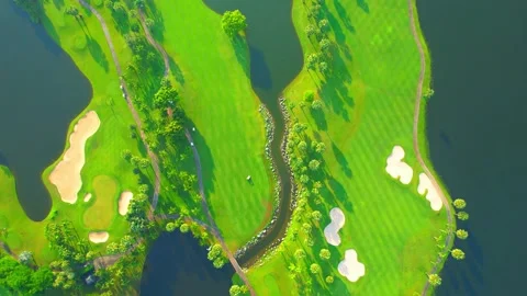 Drone flying over golf course in the morning with sunshine Stock Footage 225415399