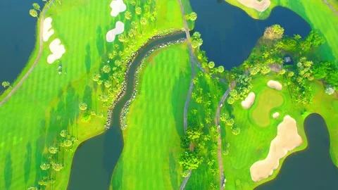 Drone flying over golf course in the morning with sunshine Stock Footage 225415661