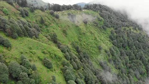 Drone Flying Over Green Mountains with Clouds | Aerial View of Mussoorie Hills Stock Footage 320664559