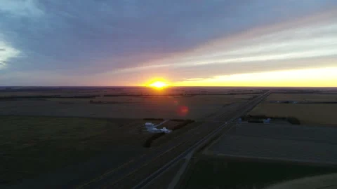 Drone Flying Over Harvested Fields As Sun Sets On The Horizon Stock Footage 229174886