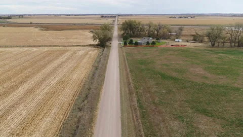 Drone Flying Over Harvested Fields Following Dirt Road Stock Footage 229182132