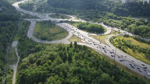 Drone flying over highway with traffic surrounded by nature  Stock Footage 252006944