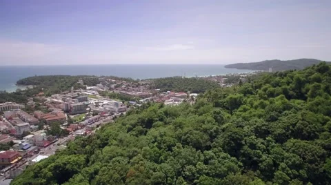 Drone Flying Over Hills Approaching Kata and Karon in Phuket Thailand Stock Footage 65458659