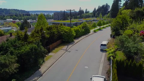 Drone Flying Over HillTop Modern Neighborhood Overlooking The City and Ocean Stock Footage