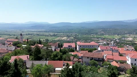 Drone Flying Over Imotski With Distant Mountain View – 4K Aerial Stock Footage 313900946