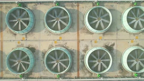 Drone flying over industrial cooling tower Stock Footage 210780906