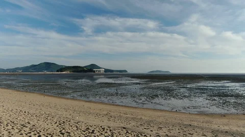 A drone flying over the island's mud flat. Stock Footage 115820425