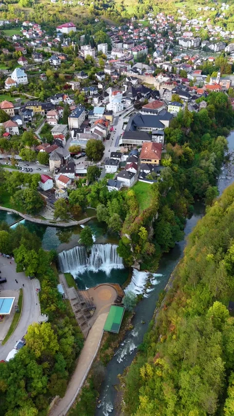 Drone flying over jajce waterfall and historic old town in bosnia Stock Footage 341778506