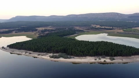 Drone flying over La Cuerda del Pozo Reservoir Видео 342606397