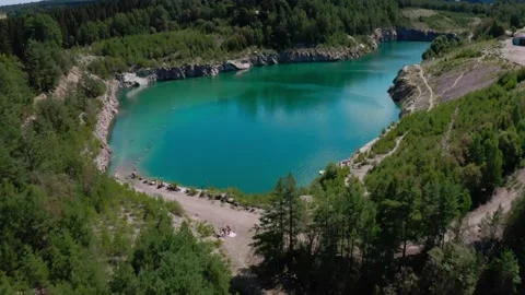Drone flying Over Lagoon In A Former Limestone Quarry Stock Footage 168817741