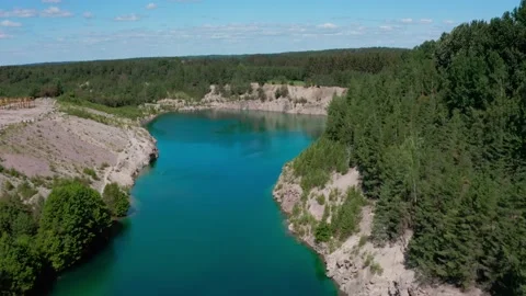 Drone flying Over Lagoon In A Former Limestone Quarry Stock Footage 168817743